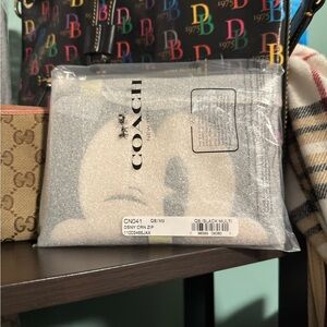 Coach Mickey Mouse wristlet